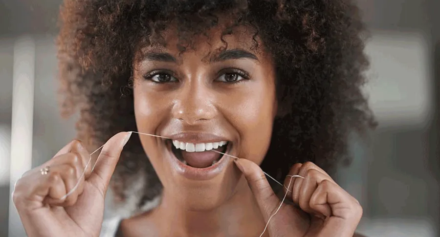 black woman flossing