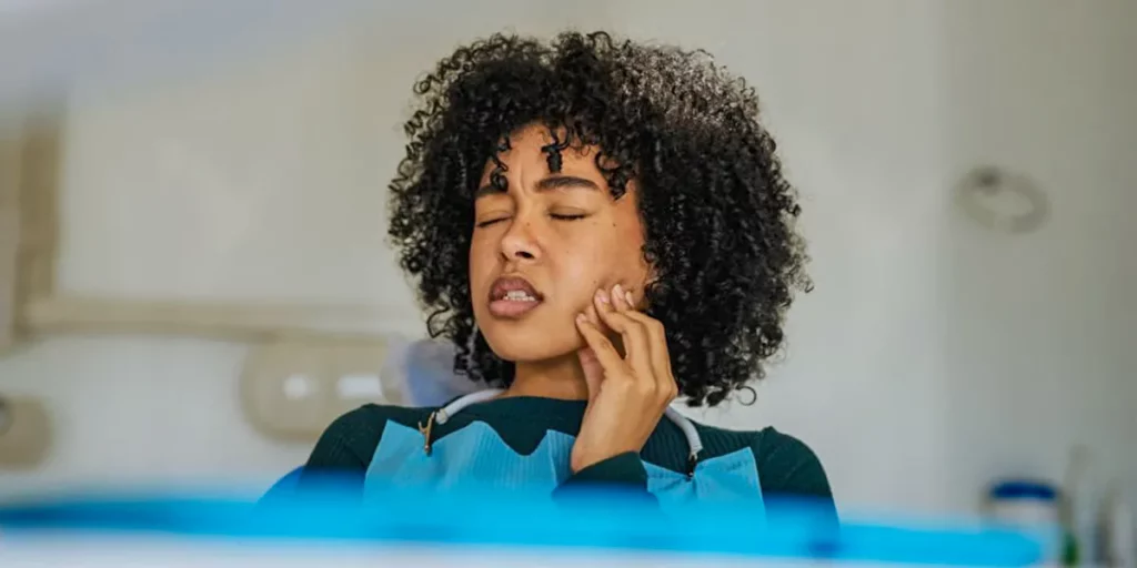 Woman with tooth pain