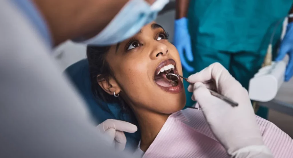 Woman getting her teeth checked at the dentist