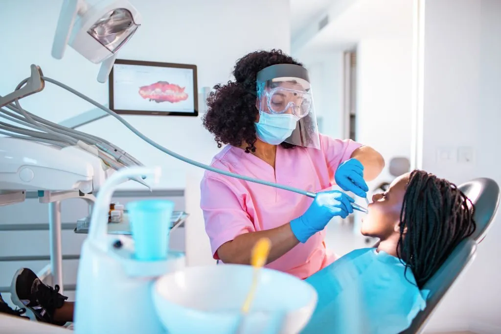 Little girl getting her teeth checked at the dentist