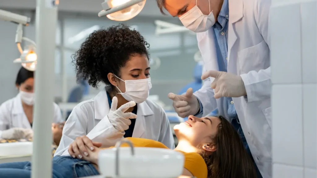 Two dentists and patient