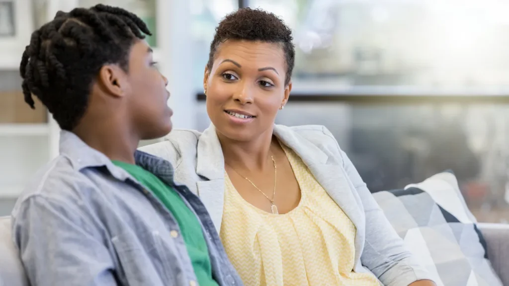 African lady listening to black guy